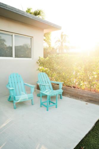 two blue chairs sitting on a patio at Waterfront Cabana 5 Key Largo in Key Largo