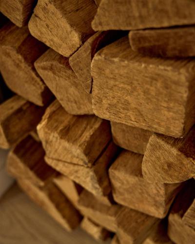 a stack of wood logs stacked on top of each other at Watthüs Morsum mit Kamin und traumhaftem Garten in Morsum