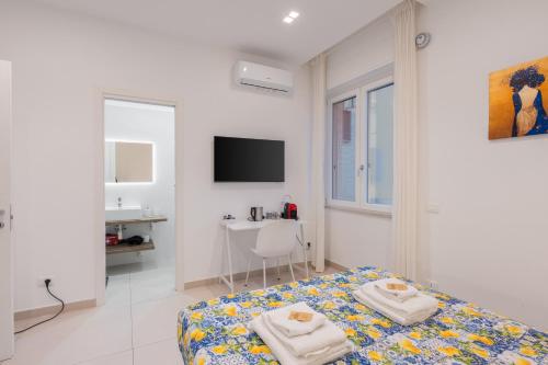TV a/nebo společenská místnost v ubytování Brezza di Stabia Rooms
