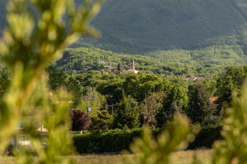 a view of a hill with a town in the distance at Velum House B&B in San Massimo