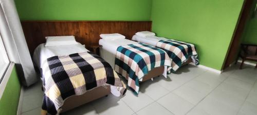 Katil atau katil-katil dalam bilik di Hotel Serra Catarinense