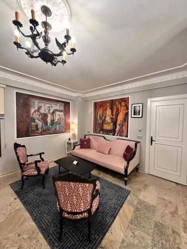 a living room with a couch and a table at Villa Ephesus Hotel in Kusadası