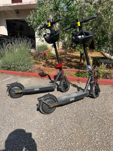 two scooters parked on the side of a street at Apartment Lara in Zaton