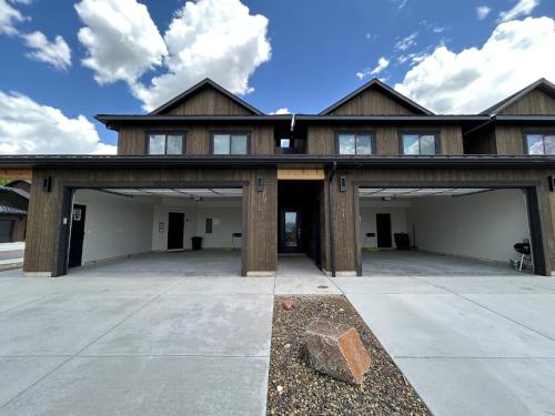 a large house with a large garage at Teton Duo | Side-by-Side Homes | Hot Tubs+Walkable in Driggs