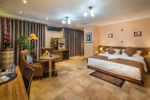 Postel nebo postele na pokoji v ubytování Midindi Hotel