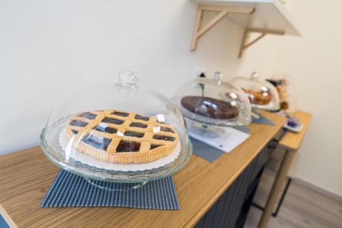 a cake on a counter with a waffle at Rooms & Breakfast Centrale in Fabriano