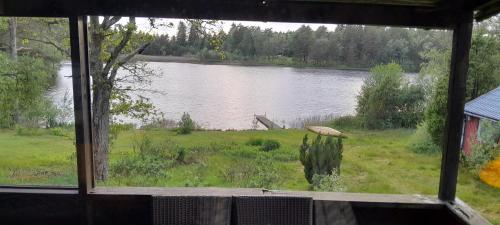 a view of a lake from a window at Landvetter in Landvetter