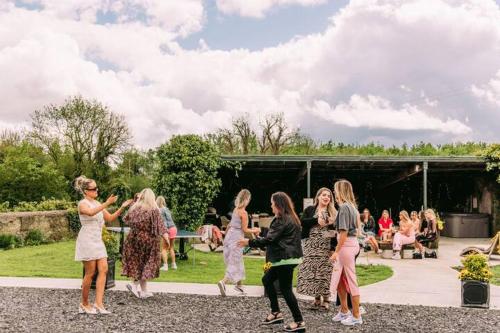 a group of women dancing in front of a crowd at Fitz Of Inch in Stradbally