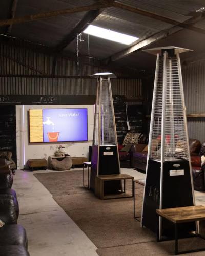 a room with two tennis rackets in front of a screen at Fitz Of Inch in Stradbally
