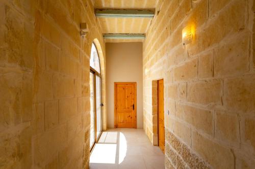 an empty hallway with a door in a wall at Nadurin Holiday Home in Nadur