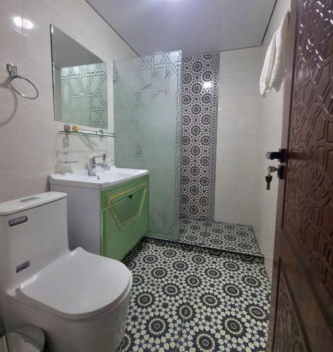 a bathroom with a toilet and a sink and a shower at Oasis al Khiva Boutique Hotel Inside Citadel in Khiva