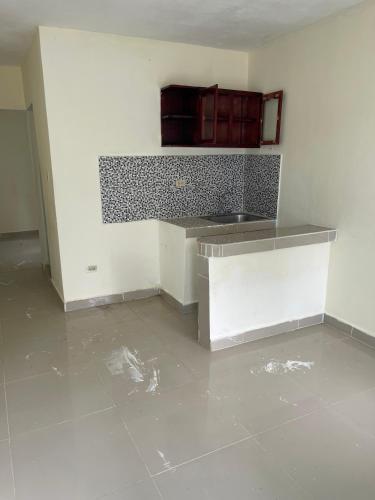 an empty kitchen with a sink and a counter at Alexel Property 