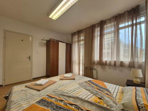Ένα ή περισσότερα κρεβάτια σε δωμάτιο στο 2 Rooms Apartment - Top Center of Burgas
