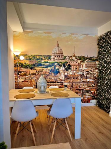 a dining room table with a view of the city at Roma Bella in El Burgo de Osma
