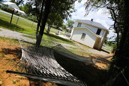 a net around a tree next to a house at 1939 Four Bed Rustic Escape by Casino in Ranson