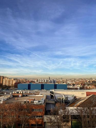 a view of a city with buildings and a sky at Ekilibrio Hotel & Apart-Suites in Madrid