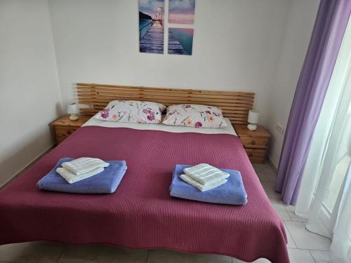 Ένα ή περισσότερα κρεβάτια σε δωμάτιο στο Sun & Fun Apartments