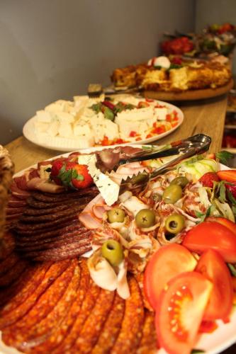 a table with a plate of food on a table at ZLATIBOR HIGHLAND in Zlatibor