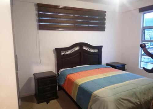 Ένα ή περισσότερα κρεβάτια σε δωμάτιο στο Apartment in cusco center