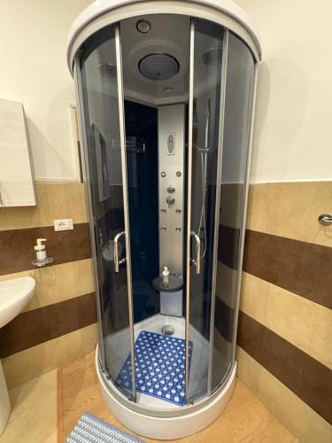 a glass shower in a bathroom with a sink at Casa Alimonda in Genoa