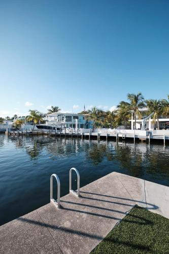 a dock with a ramp in a body of water at Waterfront Cabana 1 Key Largo in Key Largo