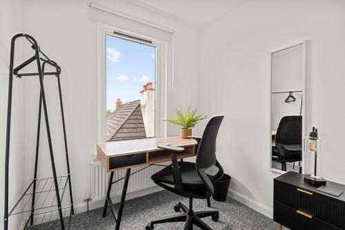 an office with a desk and a chair and a window at Ochil View 30 mins to Edinburgh and Glasgow in Falkirk