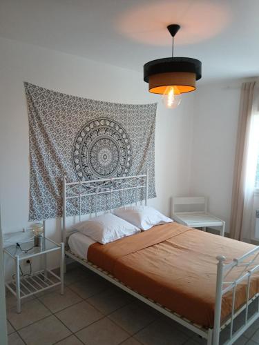 Ένα ή περισσότερα κρεβάτια σε δωμάτιο στο villa 3 chambres 5 mn de la plage