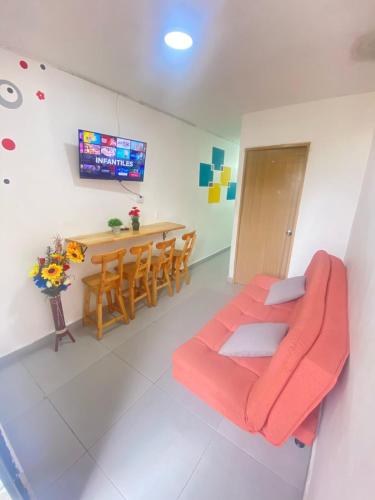 a living room with a couch and a table at 22 APARTAMENTO 3 habitaciones CON BALCON EN LAURELES ESTADIO in Medellín