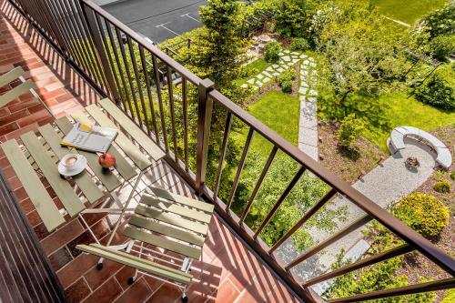 an overhead view of a park with a bench and a table at Guest House The Hive in Bled