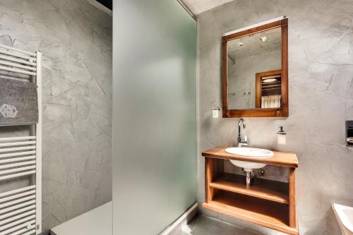 a bathroom with a sink and a mirror at Guest House The Hive in Bled