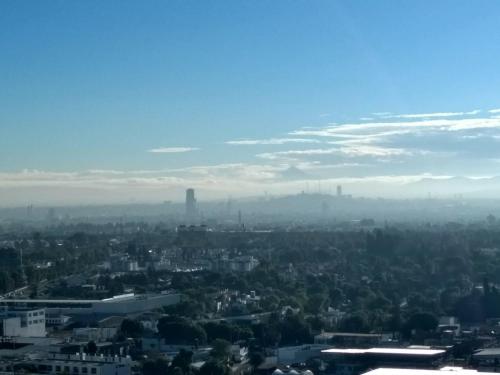 a view of a city from the sky at El rinconcito in Cholula