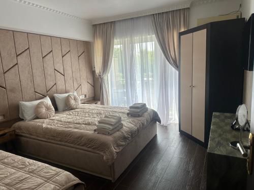 Postel nebo postele na pokoji v ubytování Beauty Complex
