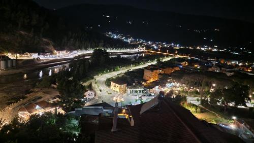 a view of a city at night with lights at Vila Luen in Berat