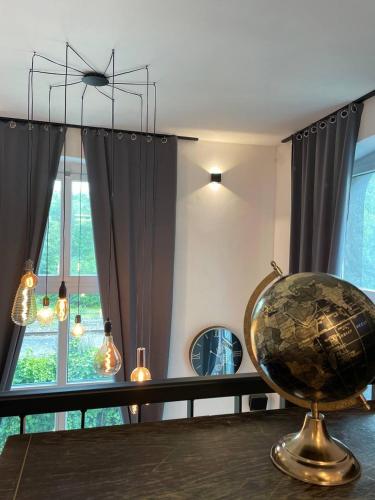 a room with a globe on a table in front of a window at Bahnhofsoase - Wellness & Spa am Krufter Bahnhof in Kruft