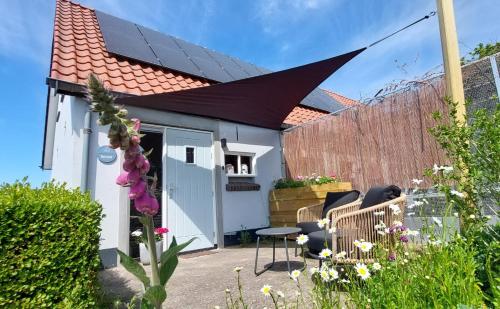 a solar roof on a house with a patio at B&B Country Suite Den Oord in Terwolde