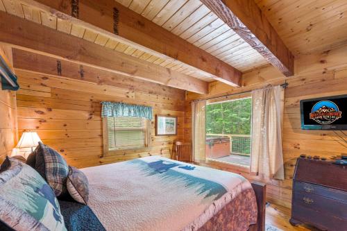 a bedroom with a bed in a log cabin at Pine Ridge in Sevierville
