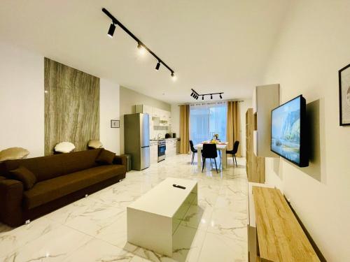 a living room with a couch and a table at See You Diego Court in St. Paul's Bay