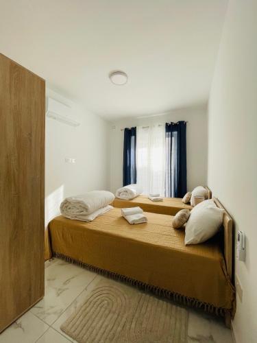 a bedroom with a large bed with pillows on it at See You Diego Court in St. Paul's Bay