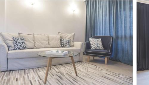a living room with a couch and a chair at Oasis Beach Club - "Valencia'' apartment in Lozenets