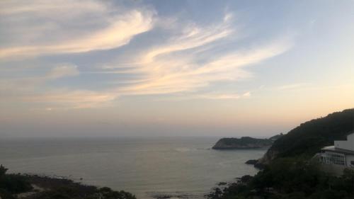 a view of the ocean from a cliff at 大梅石創生共享家士兵館 in Ma-tsu Tao