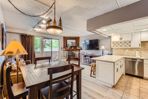 a kitchen and living room with a table and chairs at Beaver Run 1 Bedroom Condo in Breckenridge