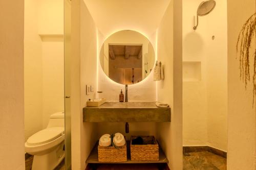 a bathroom with a sink and a mirror at Moet Cartagena Hotel Boutique Adutls Only in Cartagena de Indias