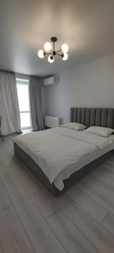 En eller flere senge i et værelse på Стильний Люкс Яровиця