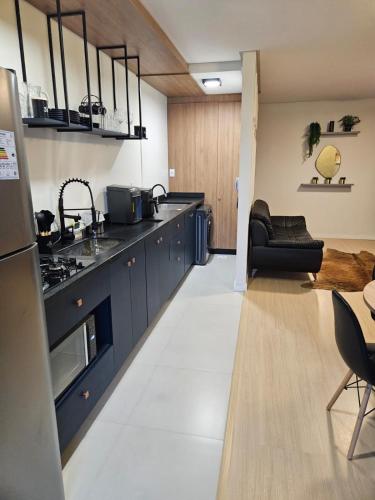 Η κουζίνα ή μικρή κουζίνα στο Apartamento Suíte e 1Q Premium Centro com Piscina, Academia e Garagem
