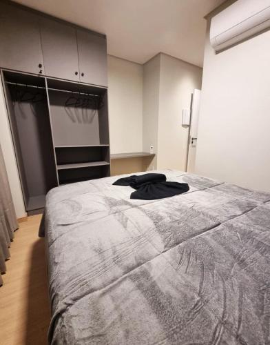 Ένα ή περισσότερα κρεβάτια σε δωμάτιο στο Apartamento Suíte e 1Q Premium Centro com Piscina, Academia e Garagem