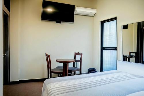 Postel nebo postele na pokoji v ubytování Hotel Sueño Tropical