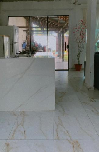 an empty room with a table in a building at Casa em Salinas Pá in Salinópolis