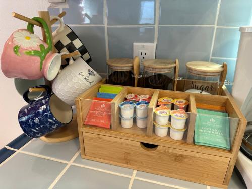 a wooden box filled with different items on a kitchen counter at NEW Beach Home with Canopy Bed and Work Spaces in Manhattan Beach