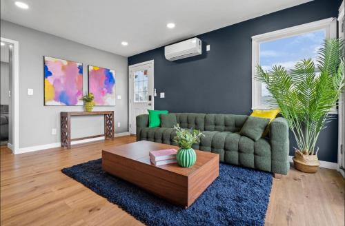 a living room with a couch and a coffee table at Twilight Terrace - Telescope - 15 Min to Beach in Hawthorne