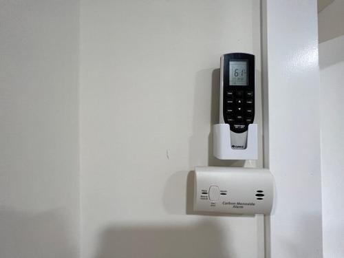 a soap dispenser is attached to a wall at Quiet and Central 1bed1bath House, Nature Retreat in Rosemead